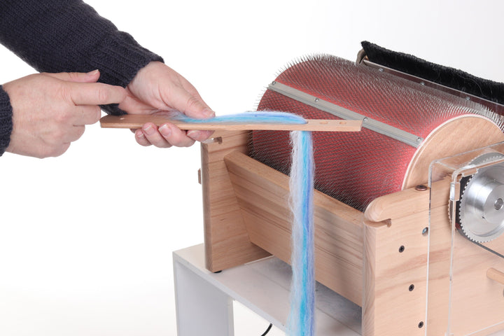 Ashford diz stick with drum carder fiber
