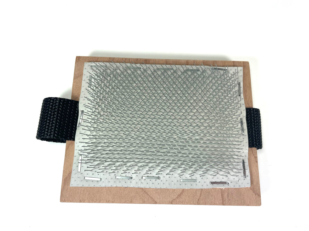 Palm flicker used to open wool locks for spinning