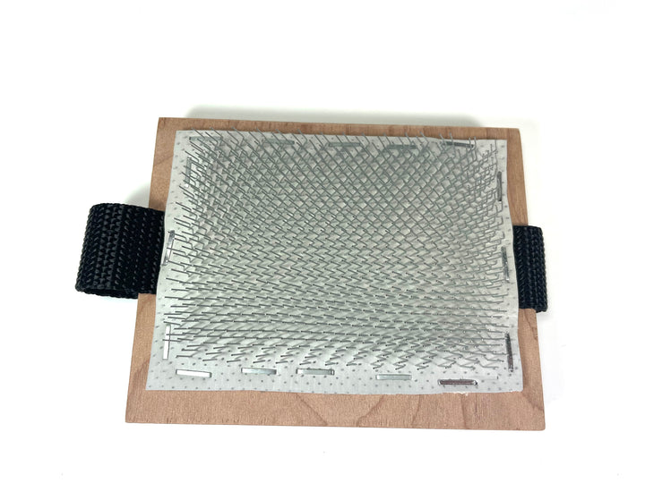 Palm flicker used to open wool locks for spinning