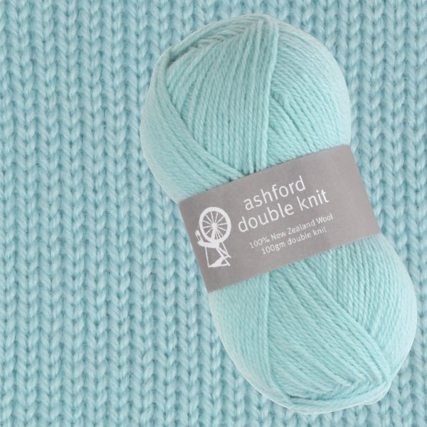 Light blue skein of yarn with 'ashford double knit' label on a knitted background