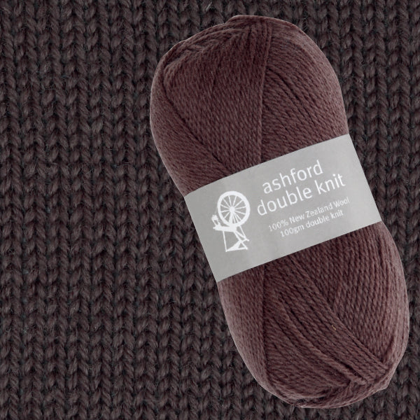 Ball of brown yarn with 'ashford double knit' label on a knitted background