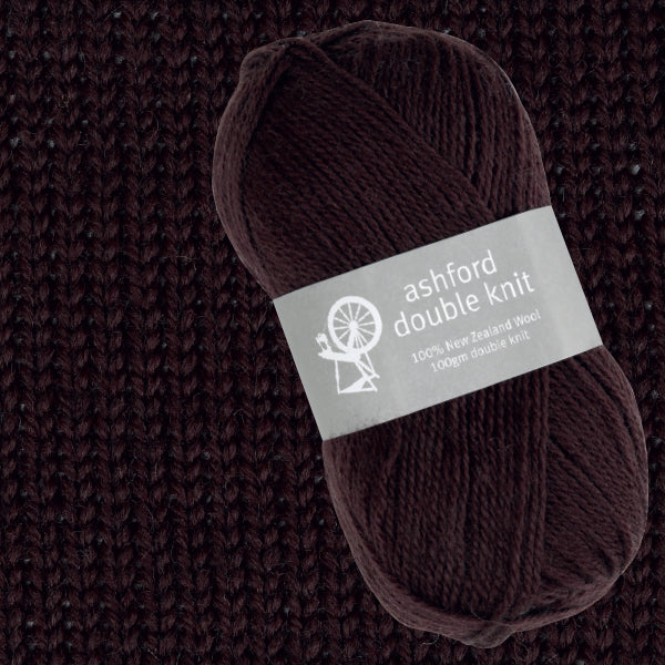 Ball of brown yarn with 'ashford double knit' label on a textured brown background