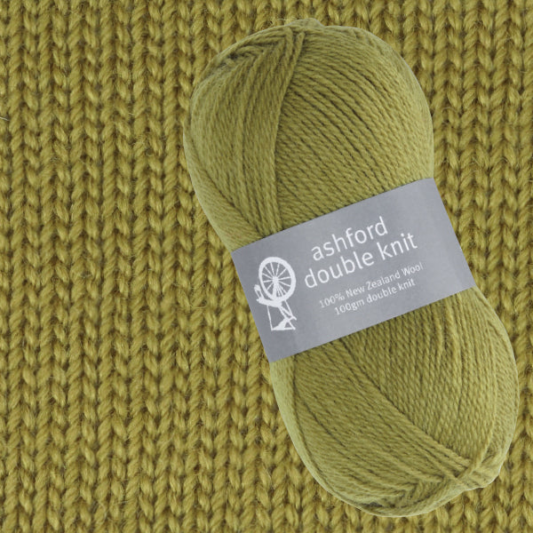 Green ball of yarn with 'Ashford Double Knit' label on a knitted fabric background