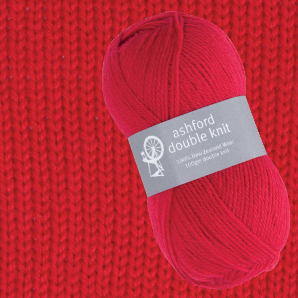 Red ball of yarn with an Ashford Double Knit label on a red knitted background