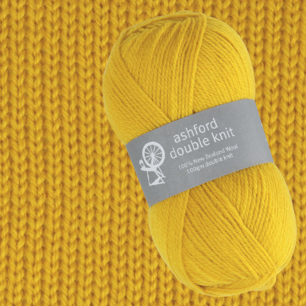 Yellow yarn ball with 'ashford double knit' label on a knitted background