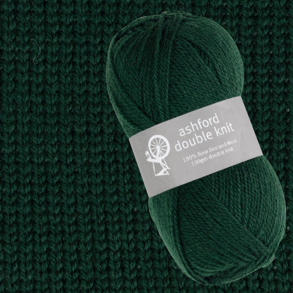 Green skein of yarn with 'ashford double knit' label on a knitted background