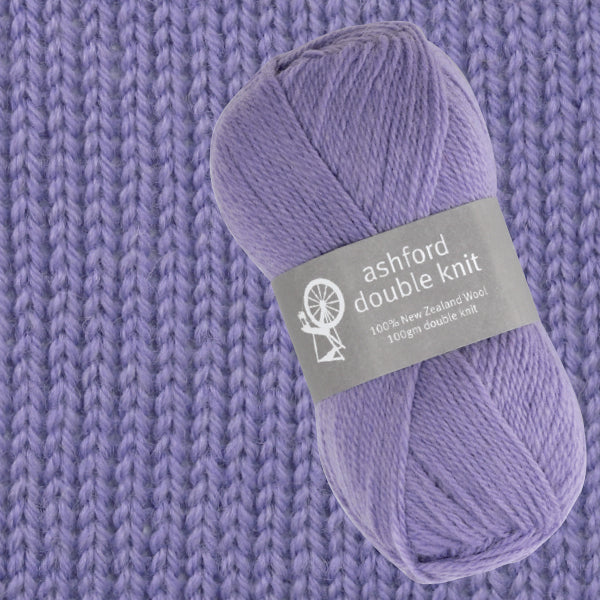 Ball of purple yarn with 'ashford double knit' label on a knitted fabric background