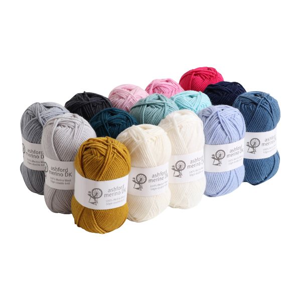 Assorted skeins of yarn in various colors with labels on a white background