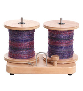 Ashford e-Spinner 3 with colorful yarn bobbins, showcasing its efficiency for spinning in fiber arts