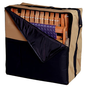 Featured here is the Ashford Katie Table Loom nestled securely within its bespoke carry bag. The loom fits snugly inside the sturdy, dual-toned canvas bag, ensuring protection and ease of transport for the traveling artisan. The bag's design allows for the loom to be moved without disassembling, ready for the next weaving project wherever it may be