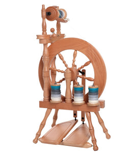 Experience the fusion of traditional craftsmanship and modern convenience with the Ashford Traveler Spinning Wheel. Crafted for fiber artists, this compact, double treadle spinning wheel showcases a rich wood finish with bobbins neatly aligned, ready to spin your favorite fibers into beautiful yarns. Its sturdy build and portable design make it ideal for spinners on the go, ensuring a high-quality, comfortable spinning session anywhere.
