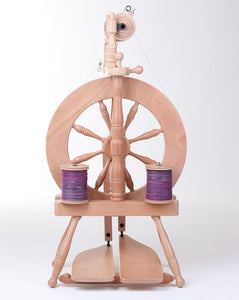 The Ashford Traveller 3 Spinning Wheel showcases a classic design with a modern touch, featuring a double treadle for smooth operation and ease of use for fiber artists.