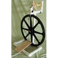 The white single treadle Babe's Production Spinning Wheel, featuring a lightweight structure ideal for crafters seeking portability without sacrificing quality