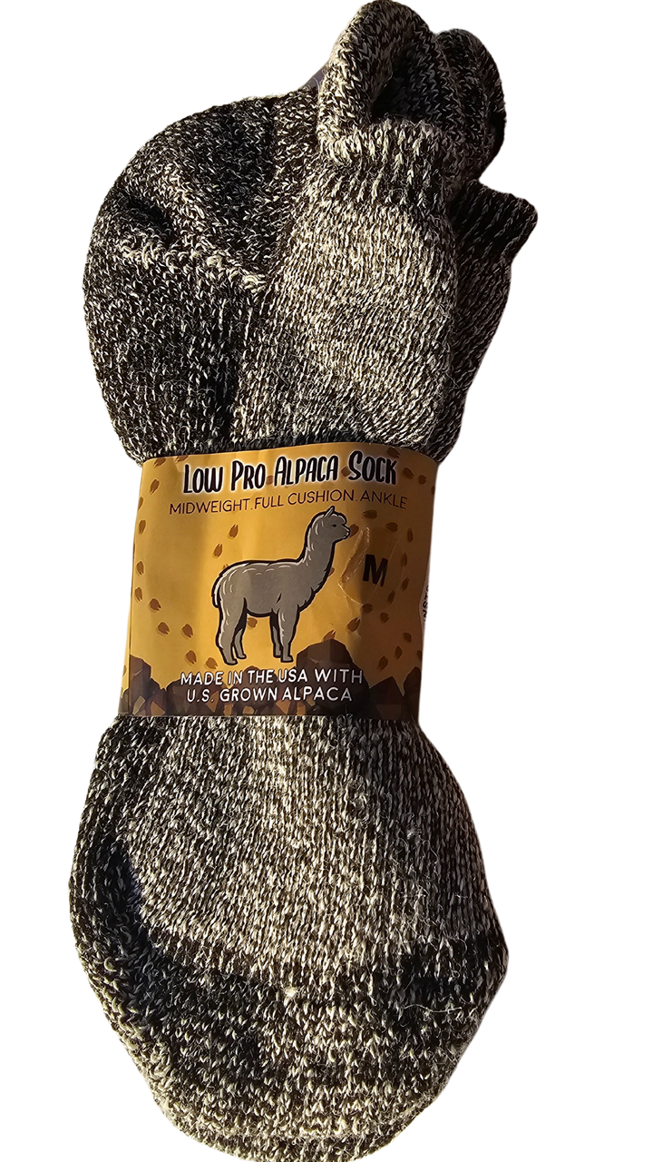 Folded Low Pro alpaca socks in natural tones, elegantly arranged to emphasize luxury, warmth, and style.