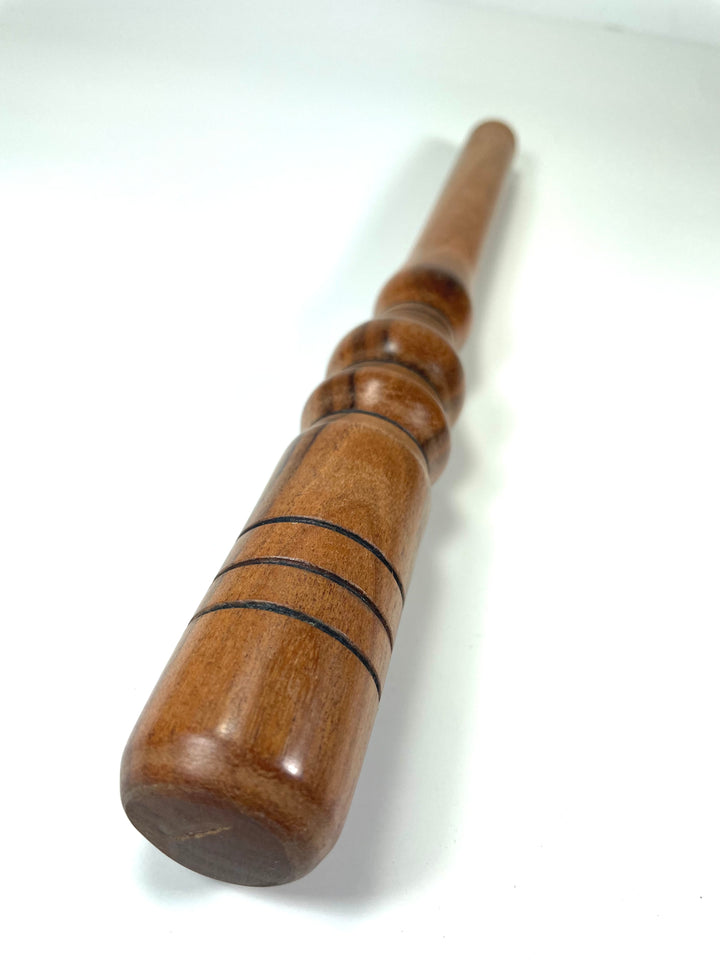 Wooden nostepinne used to wind yarn cakes