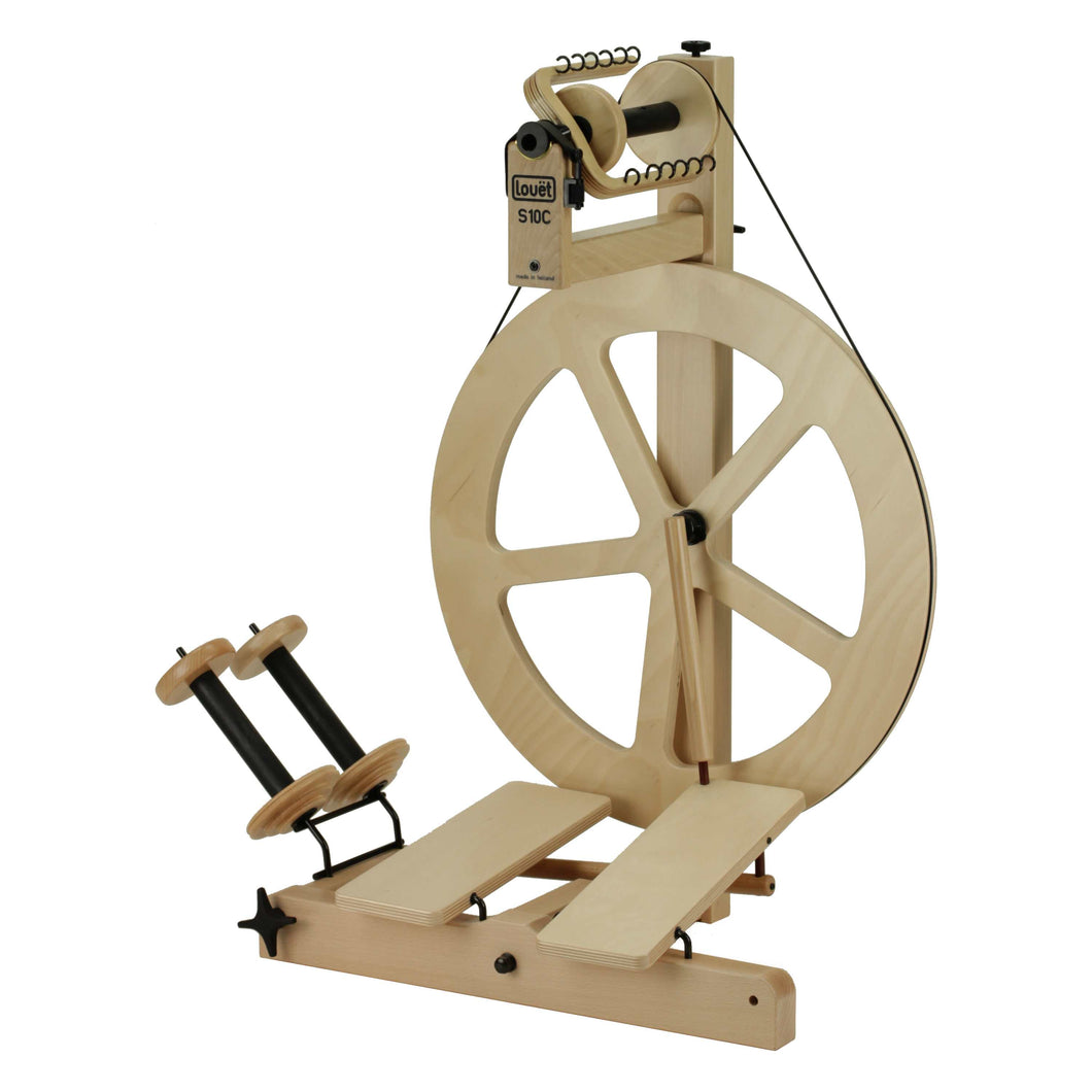 The S10 Irish Tension Double Treadle spinning wheel with a distinct five-spoke design, ideal for artisans seeking a blend of traditional charm and modern spinning technology.