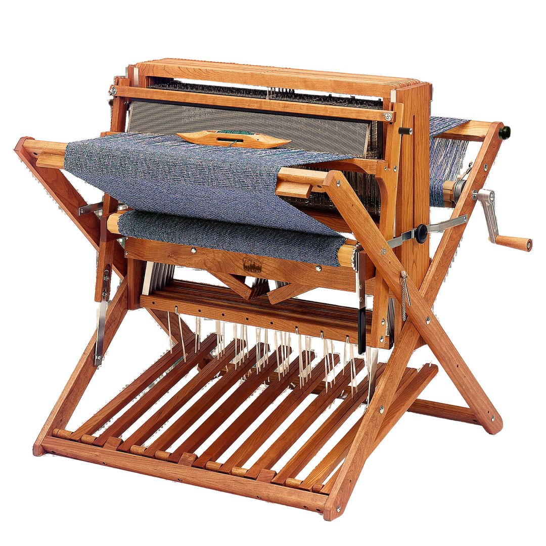 Schacht Cherry Baby Wolf Loom crafted from premium cherry wood, highlighting its rich patina and innovative foldable X-frame design.