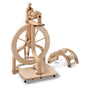  A contemporary Schacht Matchless Spinning Wheel featuring a double treadle system for smooth operation, designed for the dedicated fiber artist. The wheel's light treadling and comfortable use are evident in its modern design, blending functionality with aesthetic appeal.