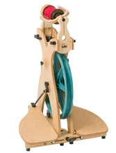 Load image into Gallery viewer, Discover the Schacht Sidekick Spinning Wheel, expertly crafted for fiber artists seeking both portability and performance. Designed with a focus on ease of use, this spinning wheel incorporates advanced technology with an aesthetically pleasing natural wood finish.
