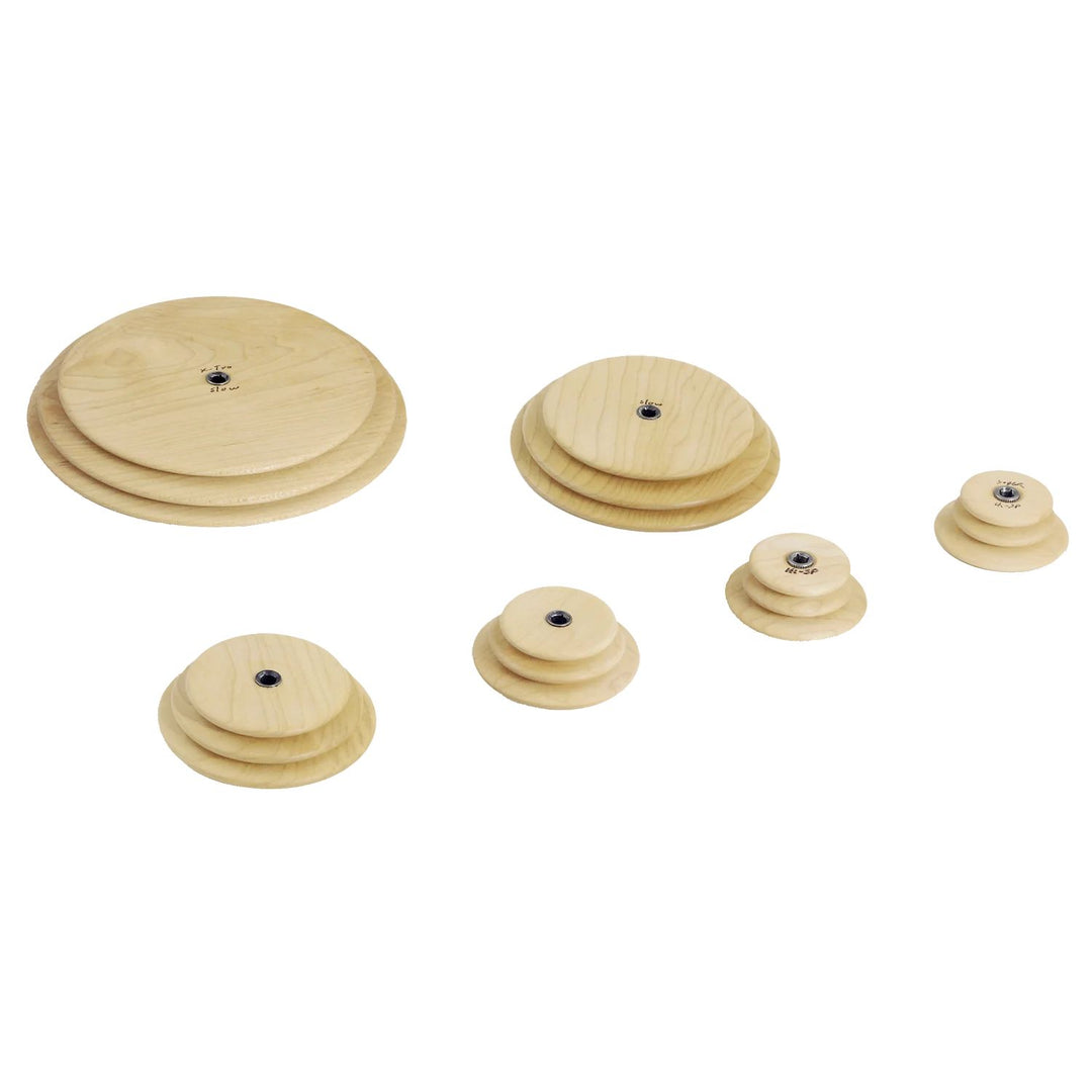Set of wooden whorls for Schacht Spinning Wheels on a white background