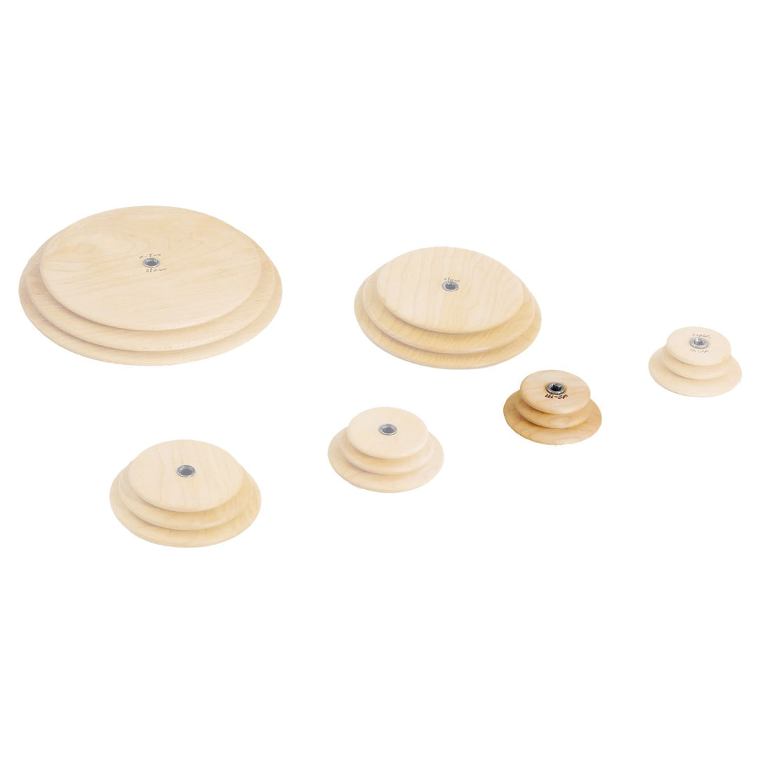 Set of wooden Schacht whorls with the high speed whorl highlighted on a white background