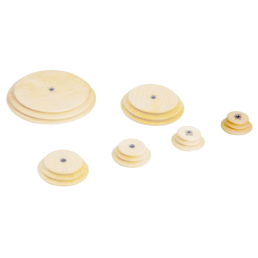 Set of wooden Schacht whorls with the super high speed whorl highlighted on a white background