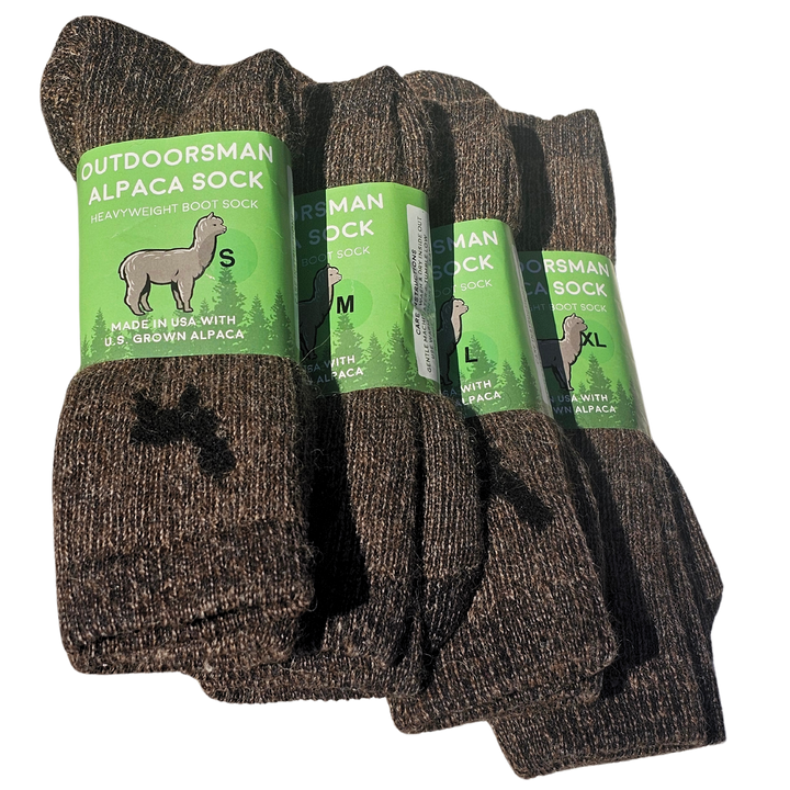 Outdoorsman alpaca socks on a rugged outdoor backdrop, emphasizing their durability and warmth for hiking and winter wear.